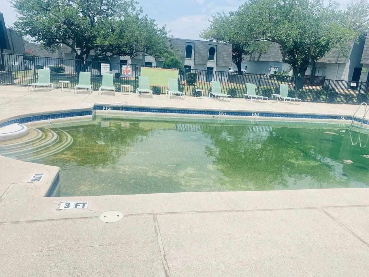 Commercial pool before cleaning service